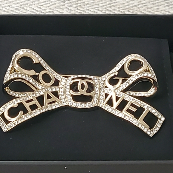 CHANEL Jewelry - Chanel Metal Bow Brooch
